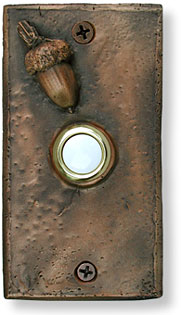 Panel with acorn bronze doorbell button