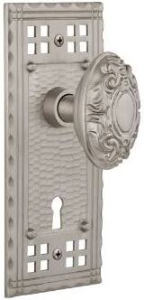 pacific doorknob with ornate oval knob in brushed nickel