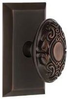 ornate oval knob in highlighted bronze