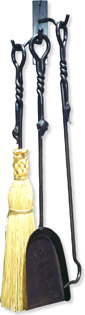 three leaf motif wrought iron fireplace tools shown on a wallmount